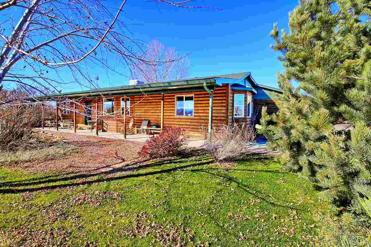 1515 19 Road Fruita, CO 81521 - Photo 8 of 42 a front view of a house with a yard