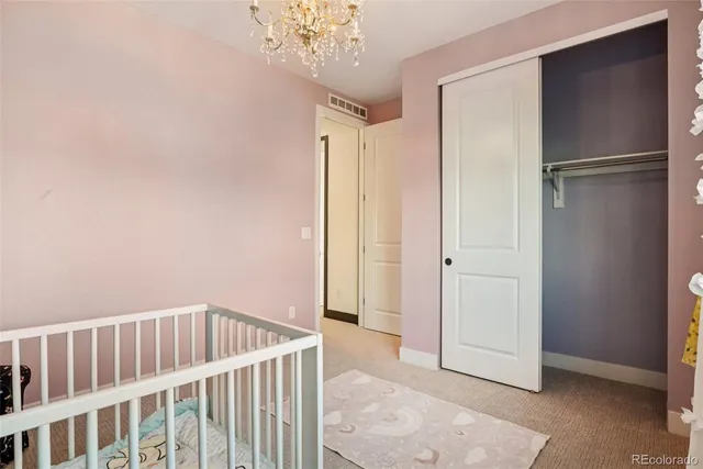 a view of an empty room with closet area