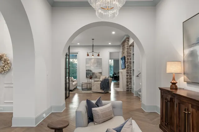 a living room with furniture and a book shelf