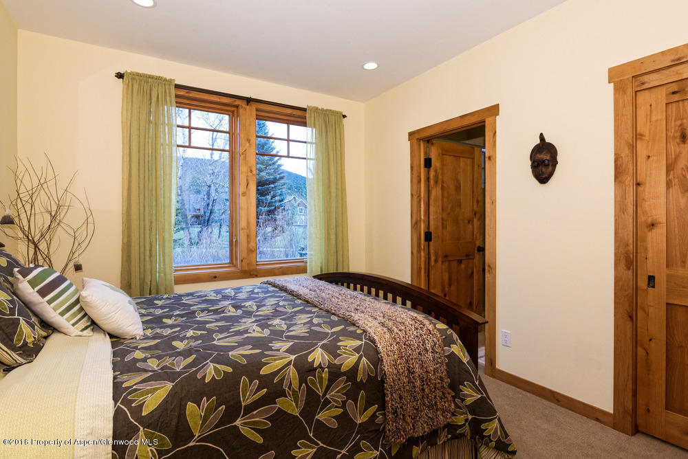 344 Sopris Circle Basalt, CO 81621 - Photo 14 of 31 a bedroom with a bed and a window