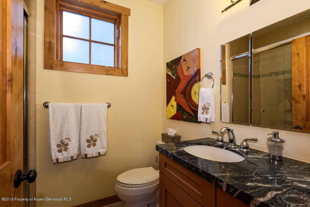 344 Sopris Circle Basalt, CO 81621 - Photo 15 of 31 a bathroom with a granite countertop sink and a mirror