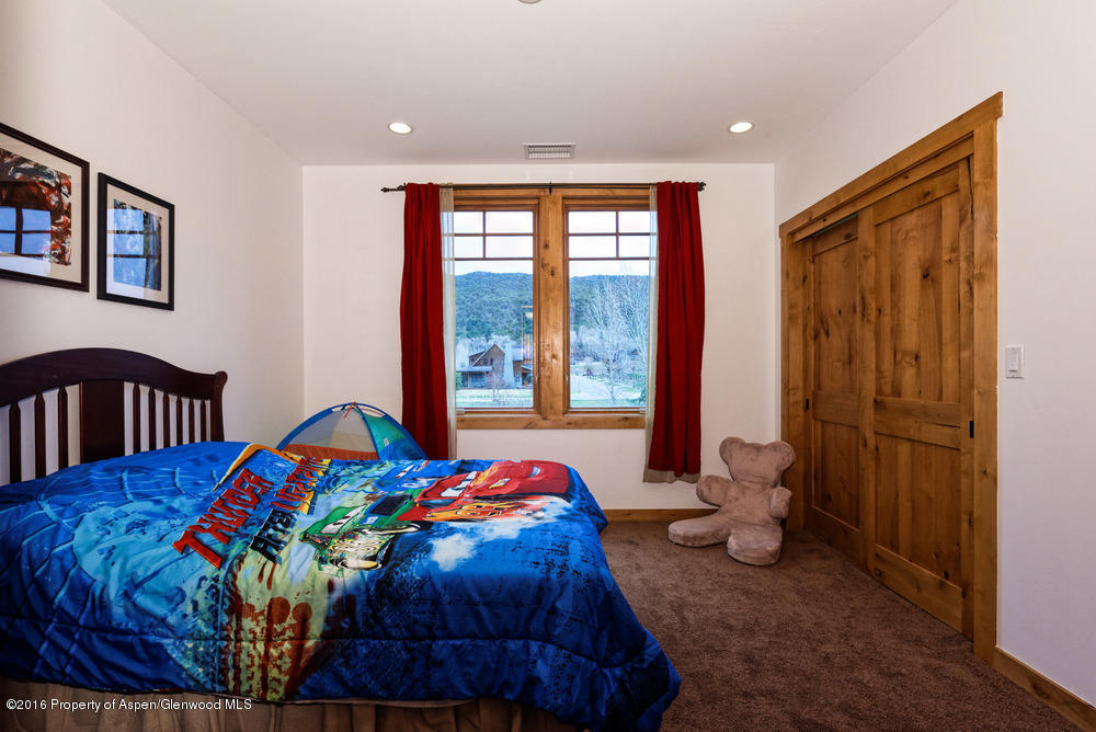 344 Sopris Circle Basalt, CO 81621 - Photo 16 of 31 a bedroom with a bed and a window