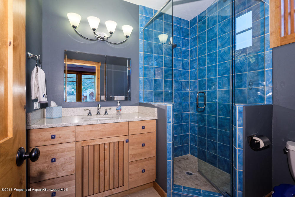 344 Sopris Circle Basalt, CO 81621 - Photo 17 of 31 a bathroom with a sink mirror and a shower