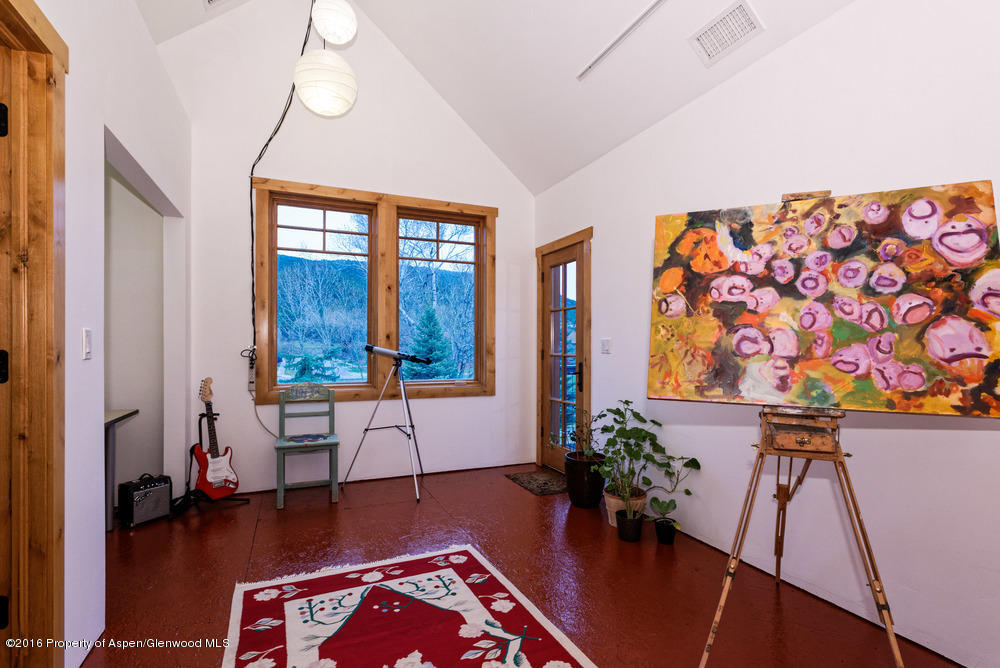 344 Sopris Circle Basalt, CO 81621 - Photo 18 of 31 a living room with furniture and a wooden floor