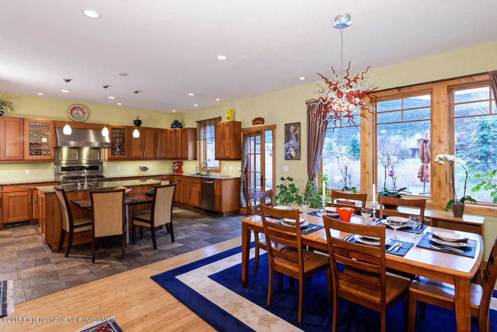 344 Sopris Circle Basalt, CO 81621 - Photo 7 of 31 a view of a dining room with furniture window and wooden floor