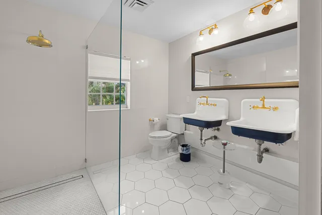 a patio with table and chairs and potted plants