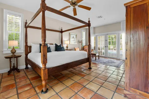 a bedroom with furniture and a window