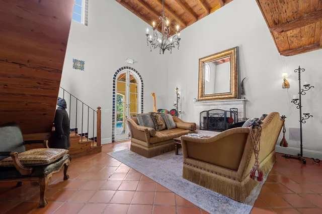 a living room with furniture a rug and a window