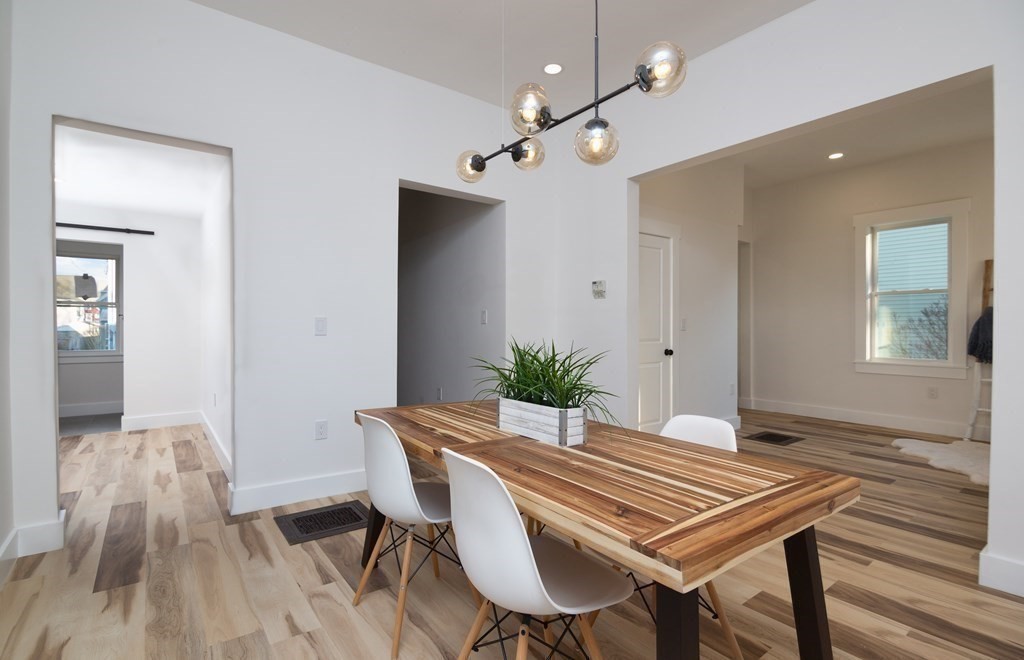 84 Dudley Street Medford, MA 02155 - Photo 11 of 27 a view of a dining room with furniture and wooden floor