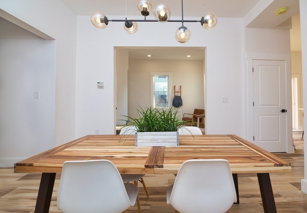 84 Dudley Street Medford, MA 02155 - Photo 12 of 27 a view of a dining room with furniture and wooden floor
