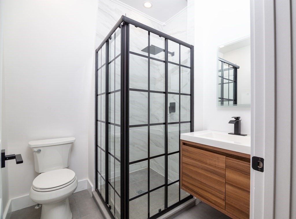 84 Dudley Street Medford, MA 02155 - Photo 20 of 27 a bathroom with a sink toilet and vanity