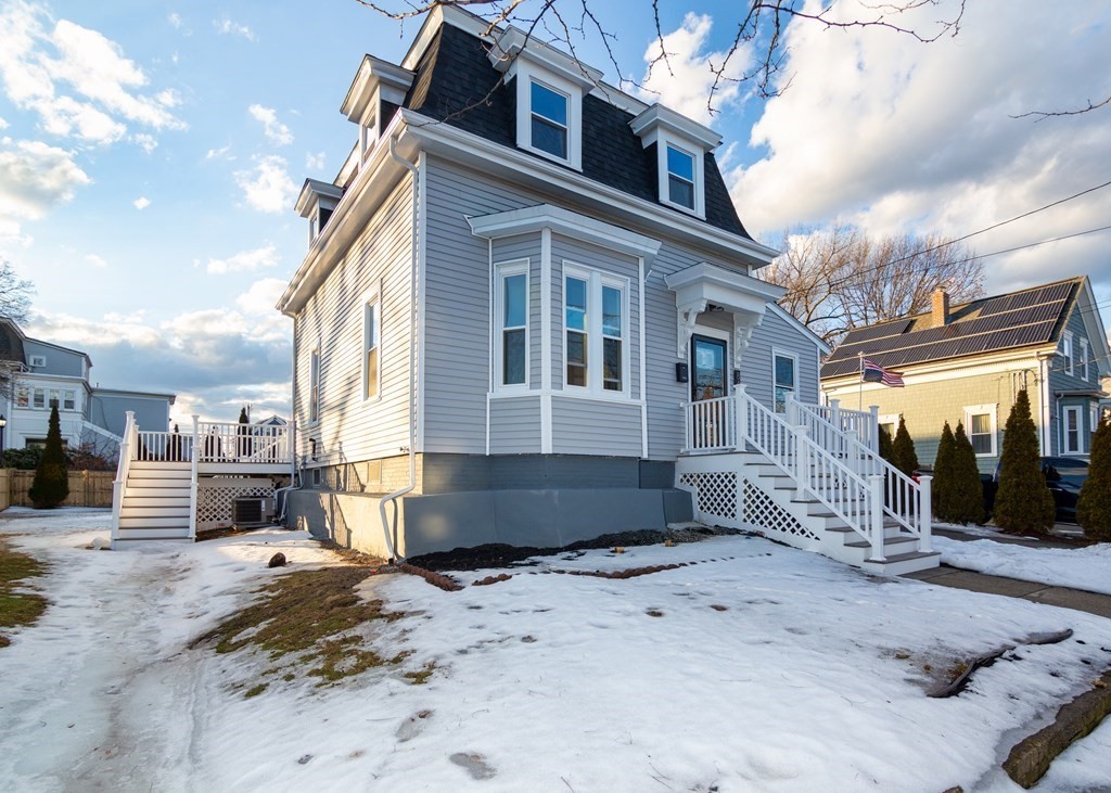 84 Dudley Street Medford, MA 02155 - Photo 2 of 27 a view of a house with a snow on the road