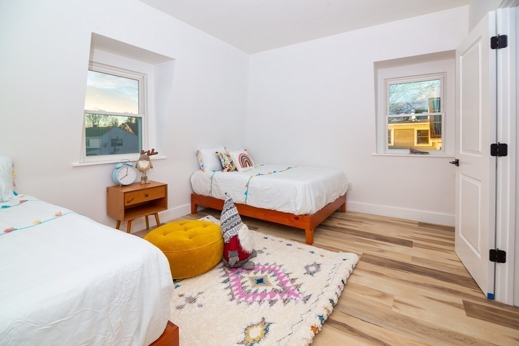 84 Dudley Street Medford, MA 02155 - Photo 22 of 27 a bedroom with 2 bed and a window