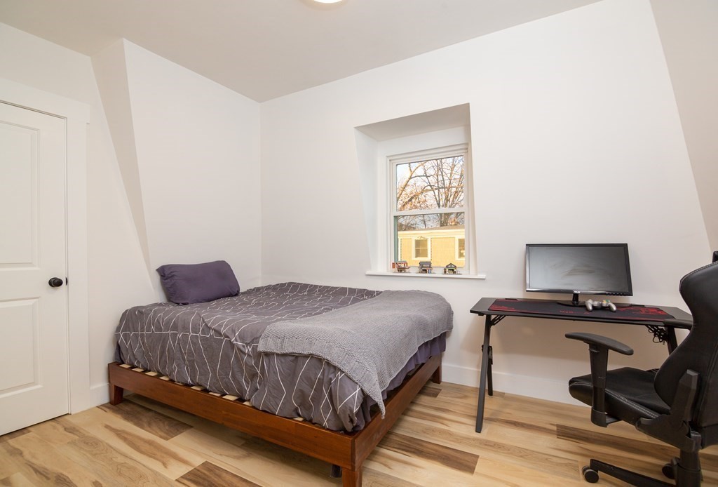 84 Dudley Street Medford, MA 02155 - Photo 26 of 27 a bedroom with a bed and a window