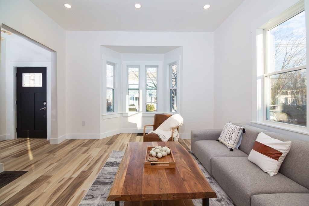 84 Dudley Street Medford, MA 02155 - Photo 6 of 27 a living room with furniture and a large window
