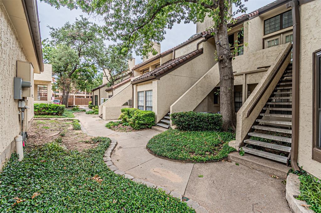 5590 Spring Valley Road, Unit C205 Dallas, TX 75254 - Photo 2 of 25 Walkway to condo