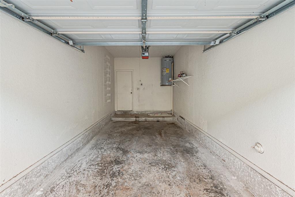 5590 Spring Valley Road, Unit C205 Dallas, TX 75254 - Photo 23 of 25 Garage with garage door opener