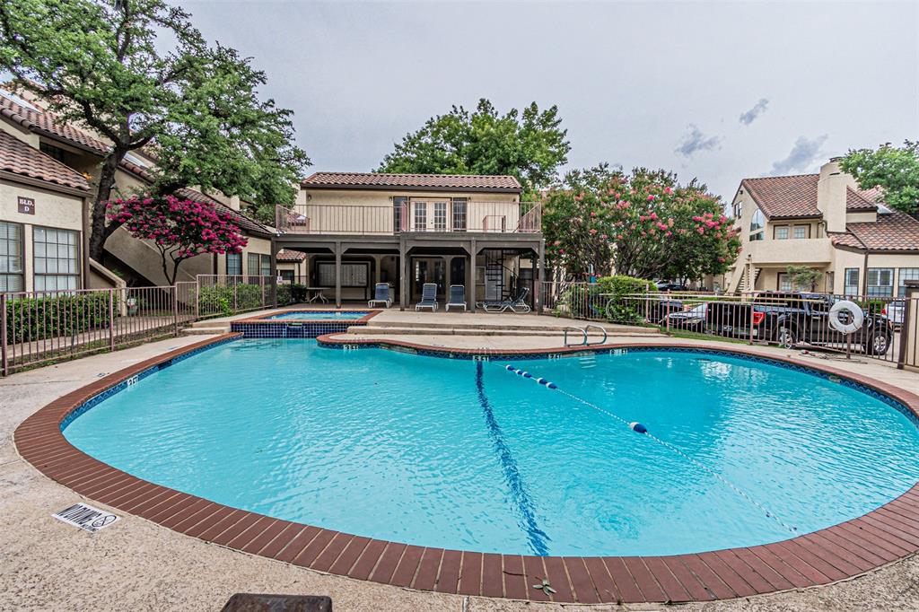 5590 Spring Valley Road, Unit C205 Dallas, TX 75254 - Photo 25 of 25 View of pool featuring a patio and a pool with connected hot tub and club house