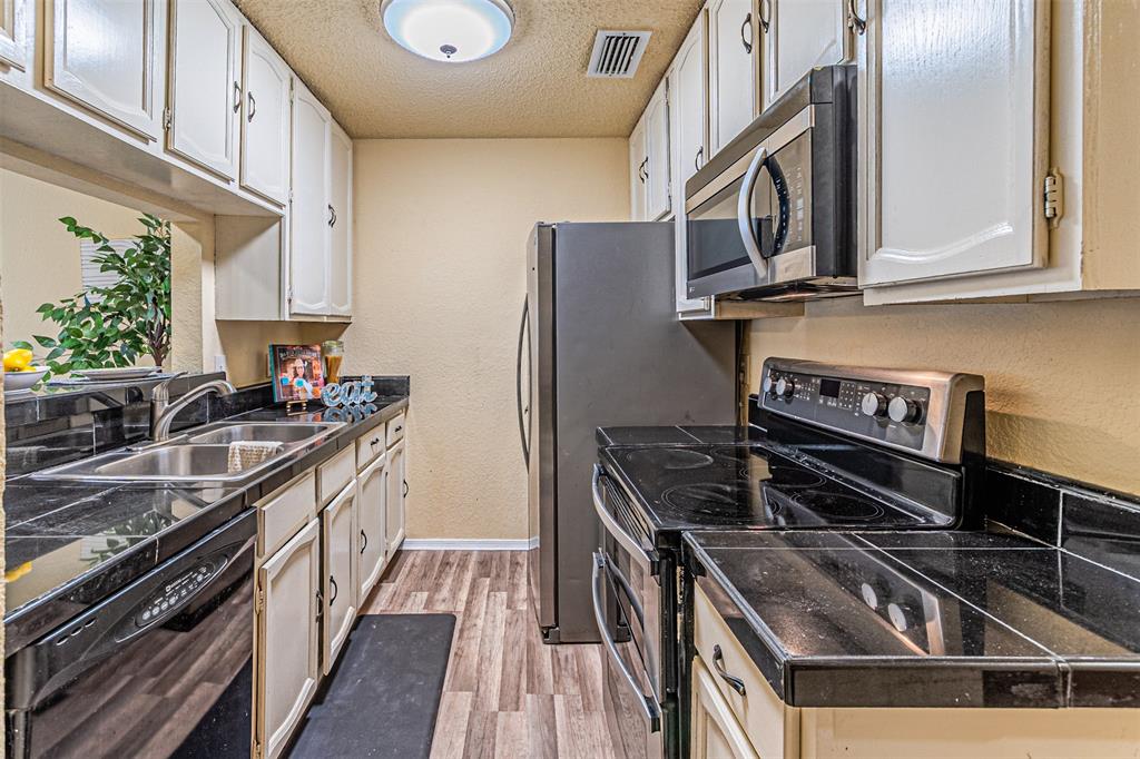 5590 Spring Valley Road, Unit C205 Dallas, TX 75254 - Photo 10 of 25 Kitchen