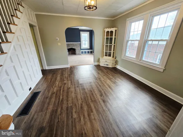 a view of gallery with wooden floor