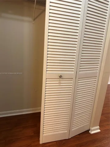 a view of a room with a white door