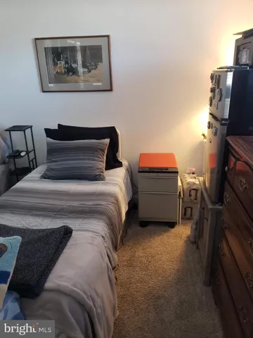 a bedroom with a bed and furniture