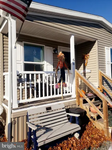 a view of a house with wooden deck