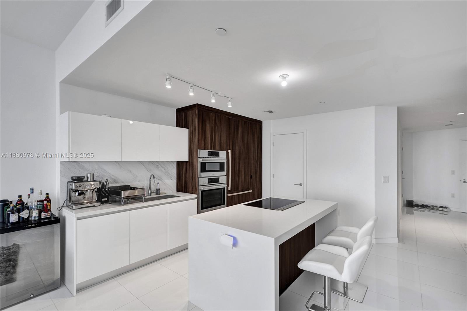 851 Northeast 1st Avenue, Unit 3800 Miami, FL 33132 - Photo 12 of 29 a kitchen with stainless steel appliances a sink stove and refrigerator