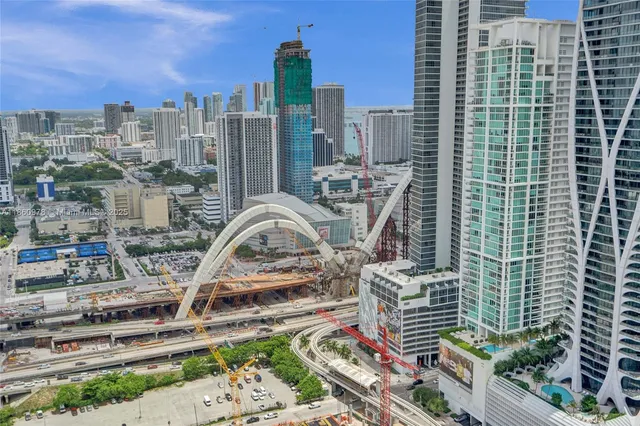 a bedroom with a large bed and a large window
