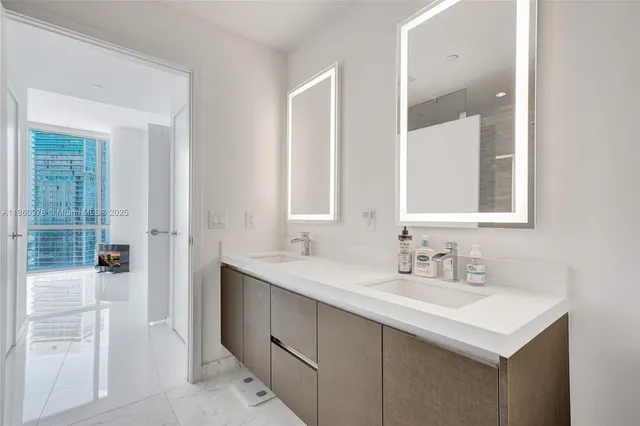 a view of a hallway with washer and dryer