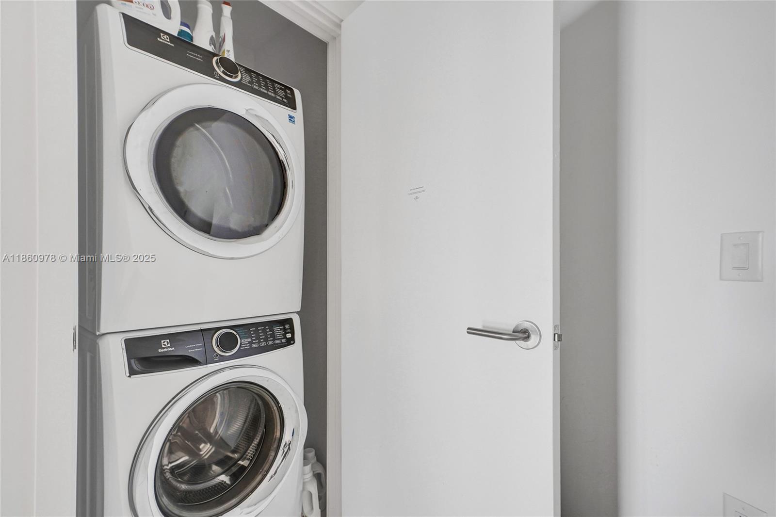 851 Northeast 1st Avenue, Unit 3800 Miami, FL 33132 - Photo 28 of 29 a view of a hallway with washer and dryer