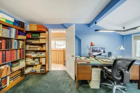 a view of a workspace with furniture and toys