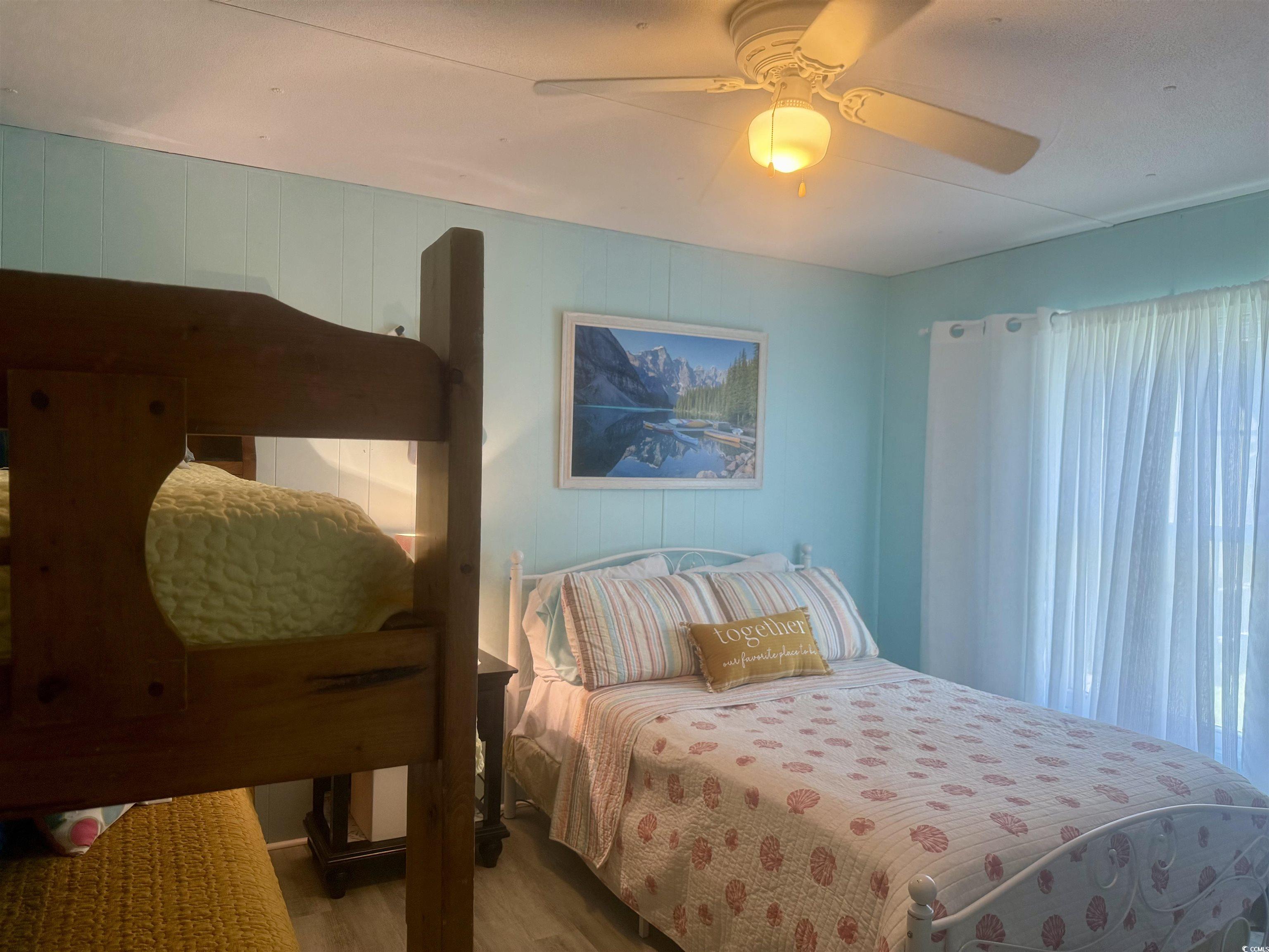 1672 Falcon Surfside Beach, SC 29575 - Photo 16 of 26 Bedroom featuring wood finished floors and ceiling fan