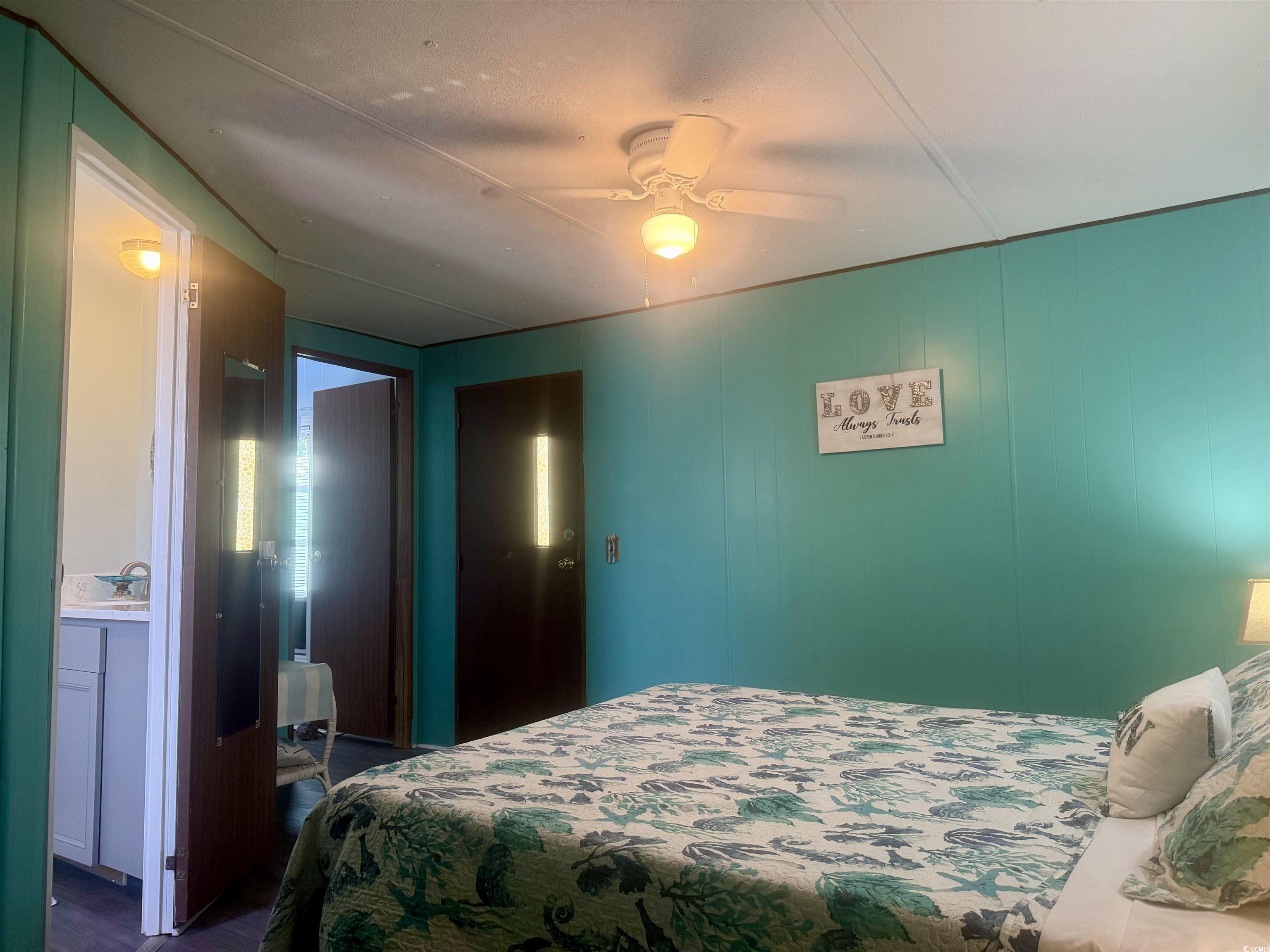 1672 Falcon Surfside Beach, SC 29575 - Photo 9 of 26 Bedroom with dark wood finished floors and a ceiling fan