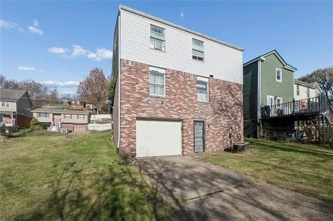 a brick building with a yard