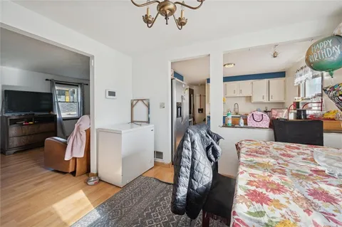 a view of a livingroom with furniture and a flat screen tv