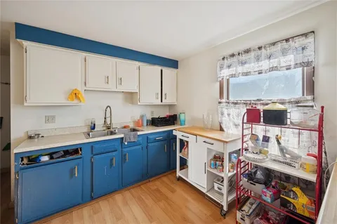 a kitchen with stainless steel appliances granite countertop a sink and cabinets