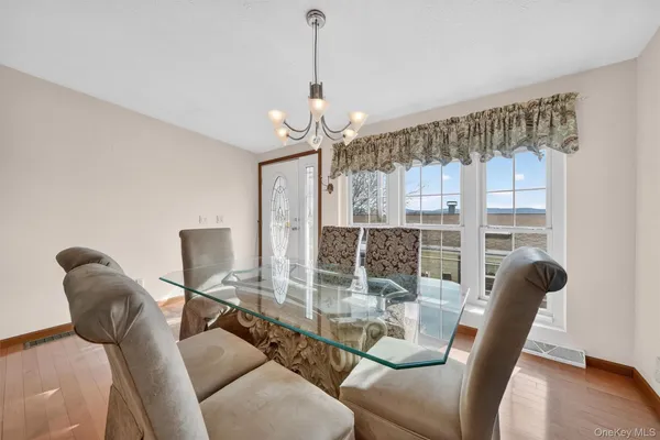 a dining room with furniture and window