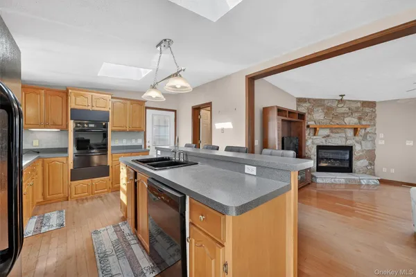 a kitchen with stainless steel appliances granite countertop a stove and a refrigerator