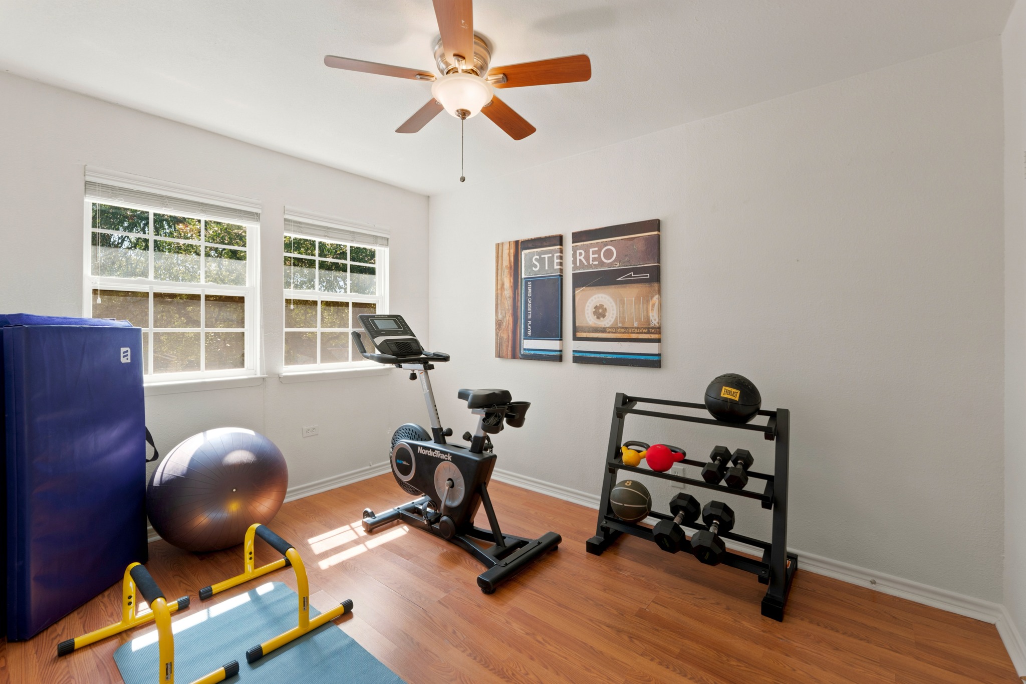 1504 Allen Road, Unit B Austin, TX 78746 - Photo 18 of 24 Warm wood flooring and abundant natural light create an inviting space for work or wellness.