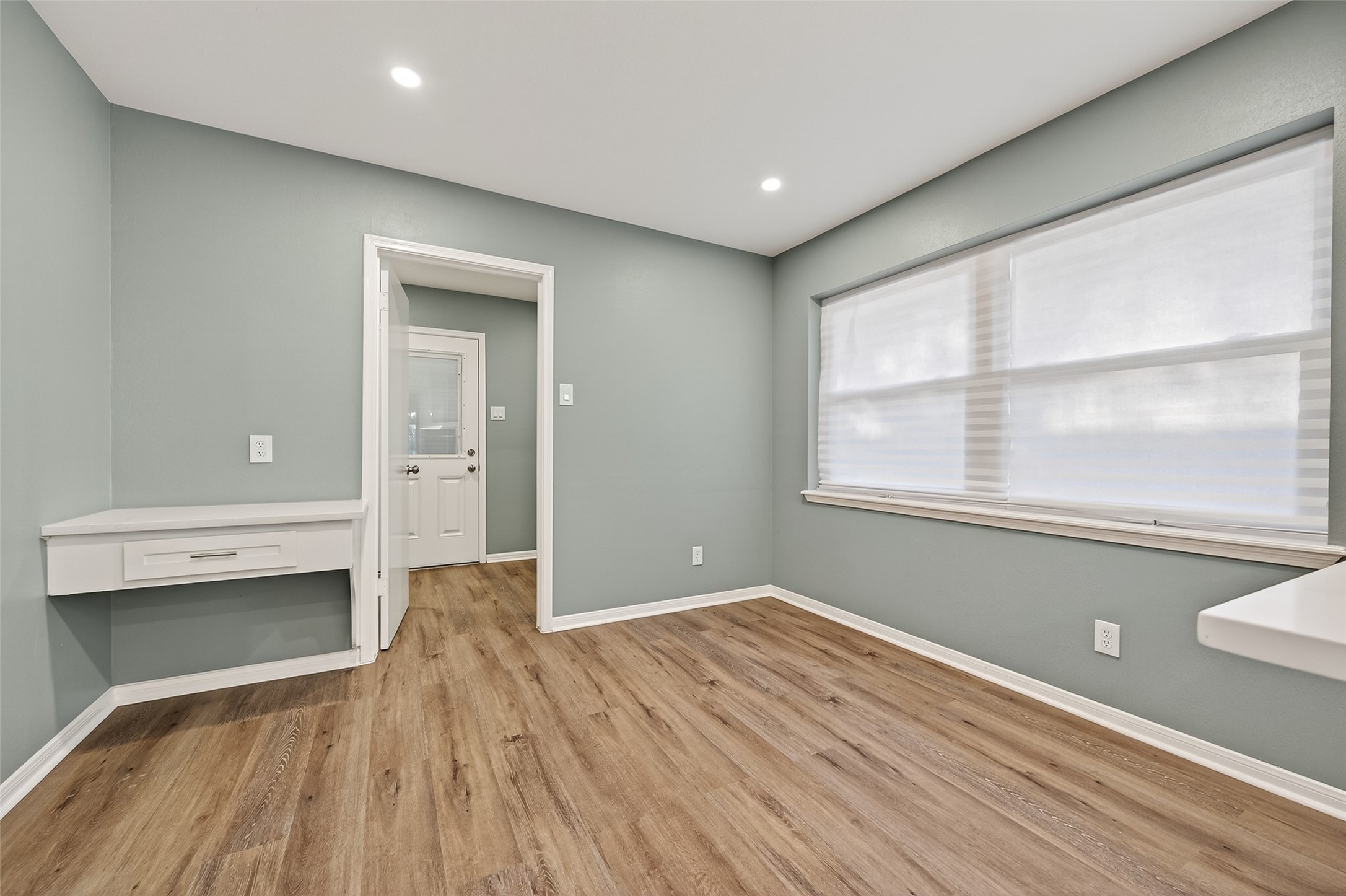902 Kingsbridge Road Houston, TX 77073 - Photo 22 of 43 This area features high-quality wood-look flooring that flows seamlessly from the sunlit breakfast nook into a functional, well-appointed laundry room. The space is unified by a modern neutral palette and provides convenient access to utility hookups and additional storage.
