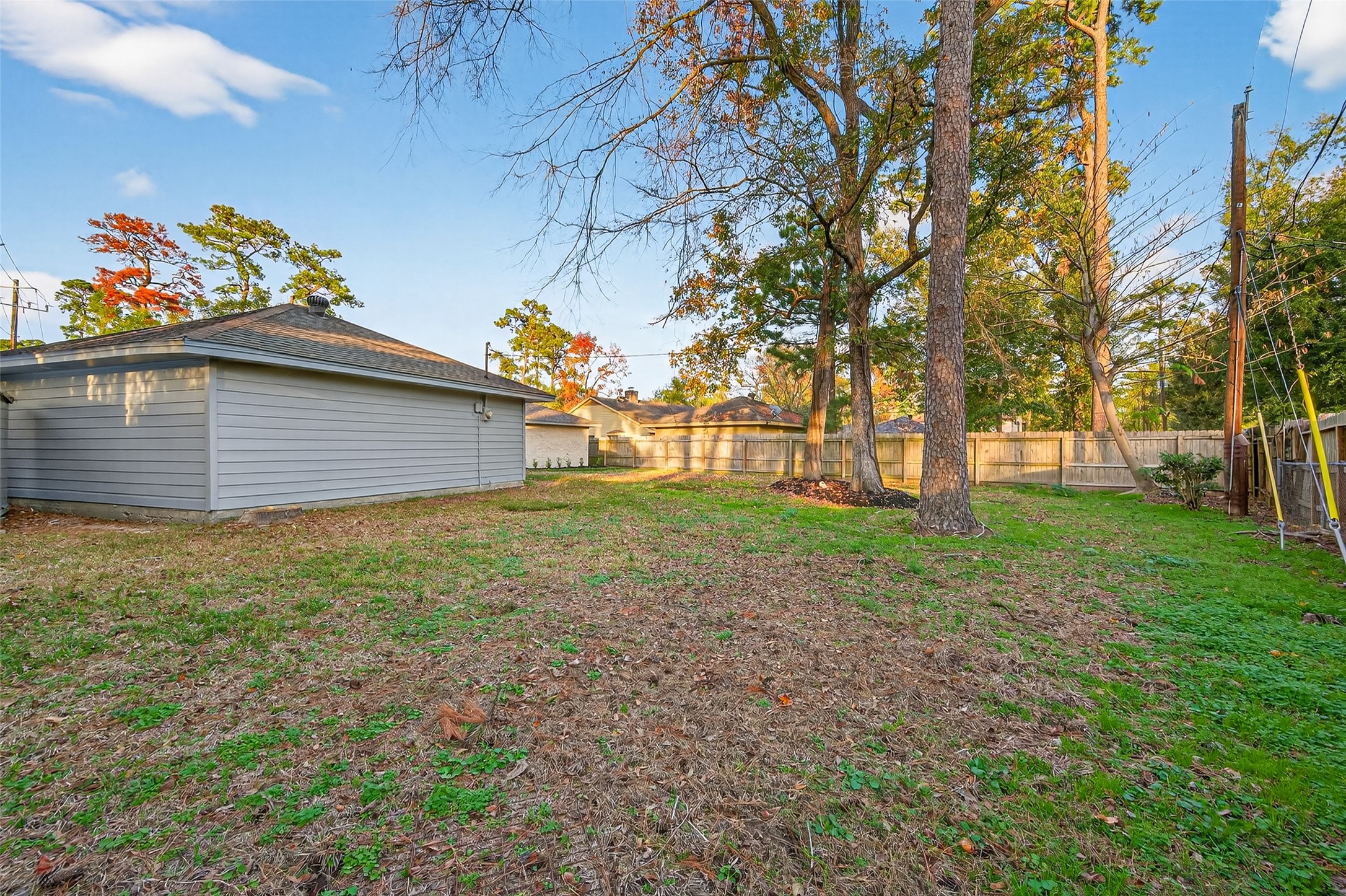 902 Kingsbridge Road Houston, TX 77073 - Photo 7 of 43 The sprawling, fully-fenced backyard offers privacy and plenty of green space for outdoor activities or gardening.