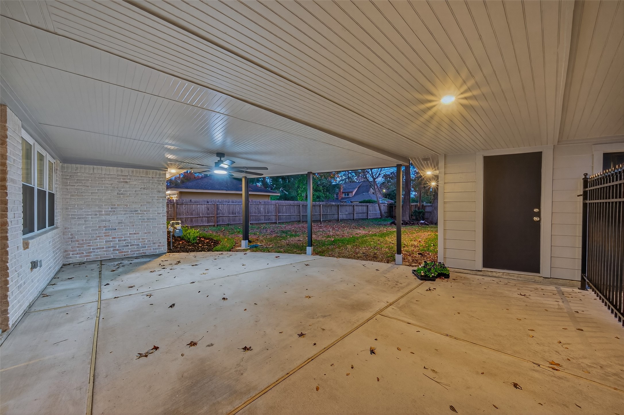 902 Kingsbridge Road Houston, TX 77073 - Photo 9 of 43 This versatile outdoor space features a high-quality beadboard ceiling with a modern cooling fan and recessed lighting.