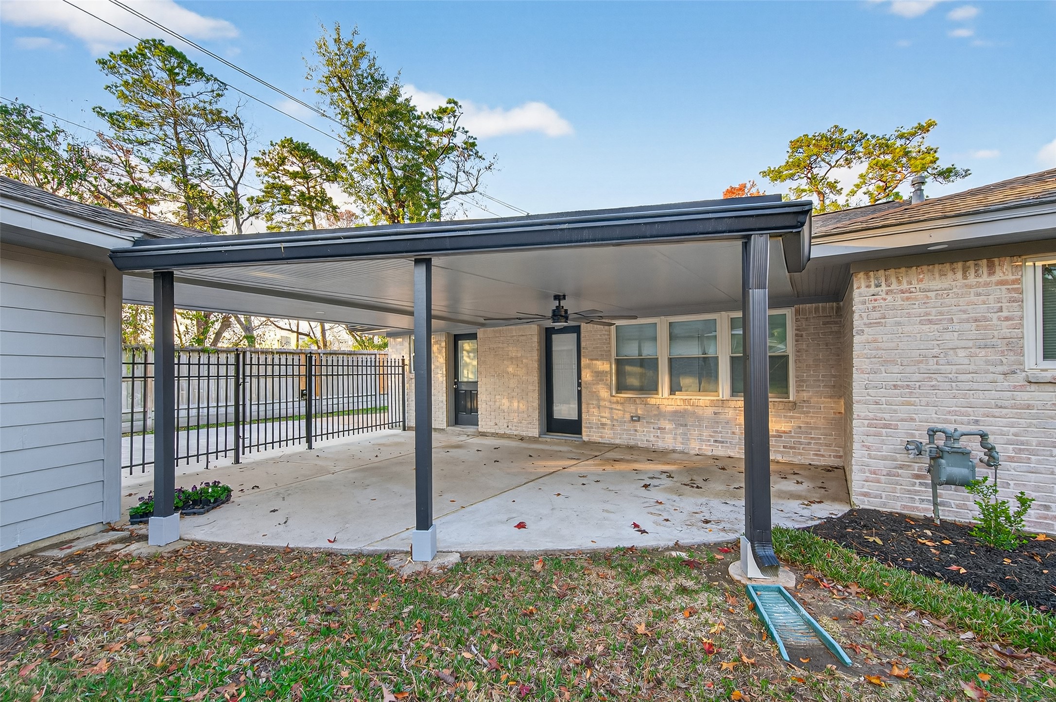 902 Kingsbridge Road Houston, TX 77073 - Photo 10 of 43 It serves as a spacious covered patio for entertaining or a protected carport, finished with clean, durable concrete.