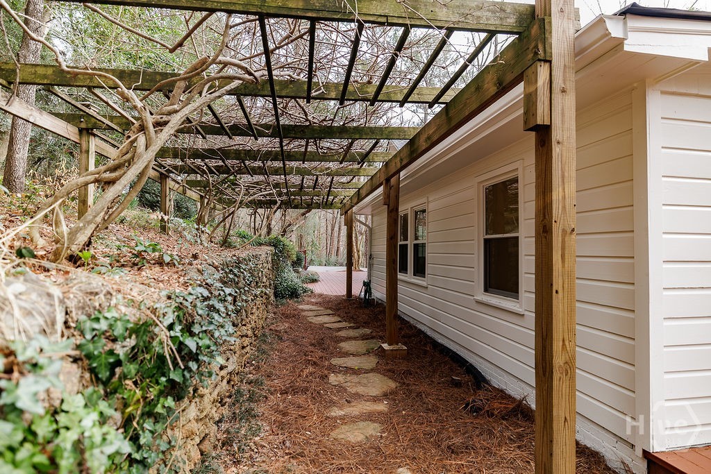 550 Fortson Road Athens, GA 30606 - Photo 42 of 50 Walkway with arbor and stone wall behind the house