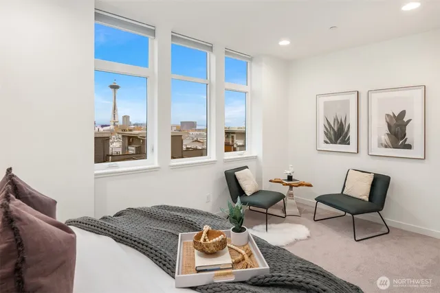 a living room with furniture and two window