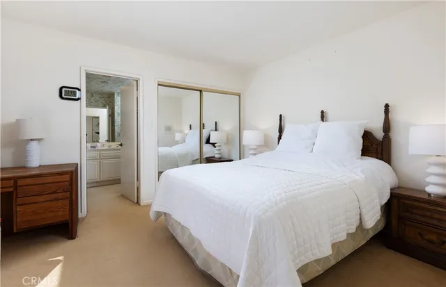 a bedroom with a bed chair and window