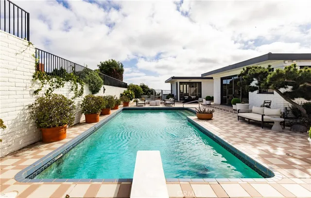 a view of a swimming pool with a patio