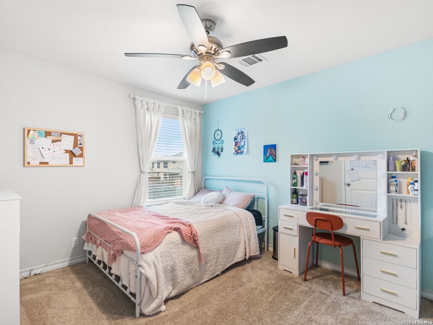 432 Salt Fork Cibolo, TX 78108 - Photo 15 of 19 a bedroom with a bed and a chandelier
