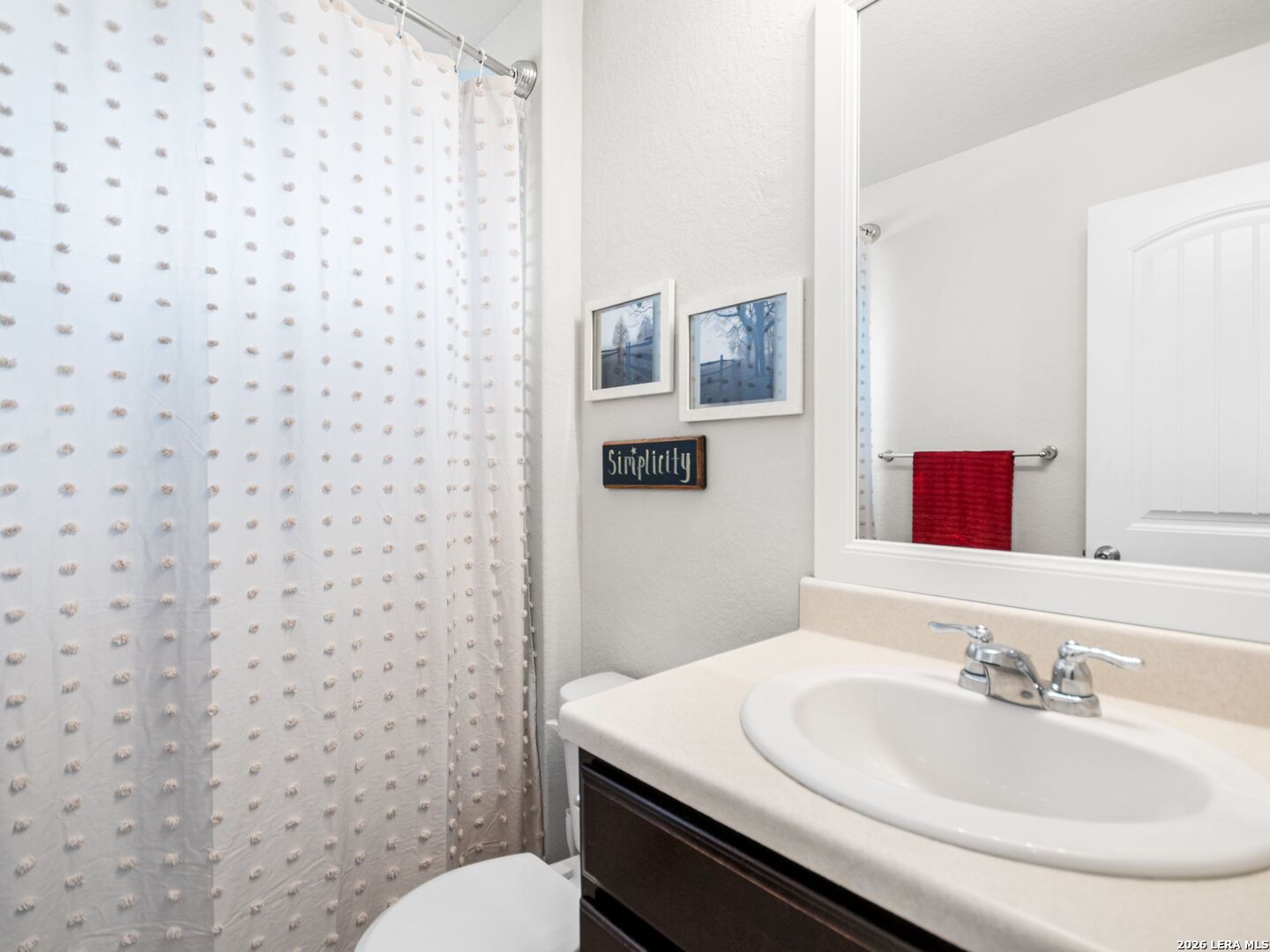432 Salt Fork Cibolo, TX 78108 - Photo 17 of 19 a bathroom with a sink and a mirror